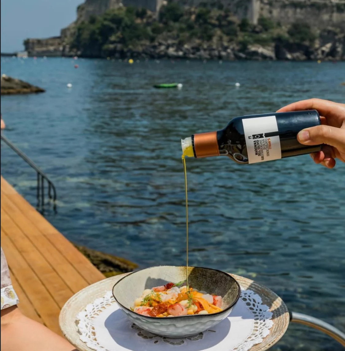 Madonna dell'Olivo olive oil over Mediterranean seafood